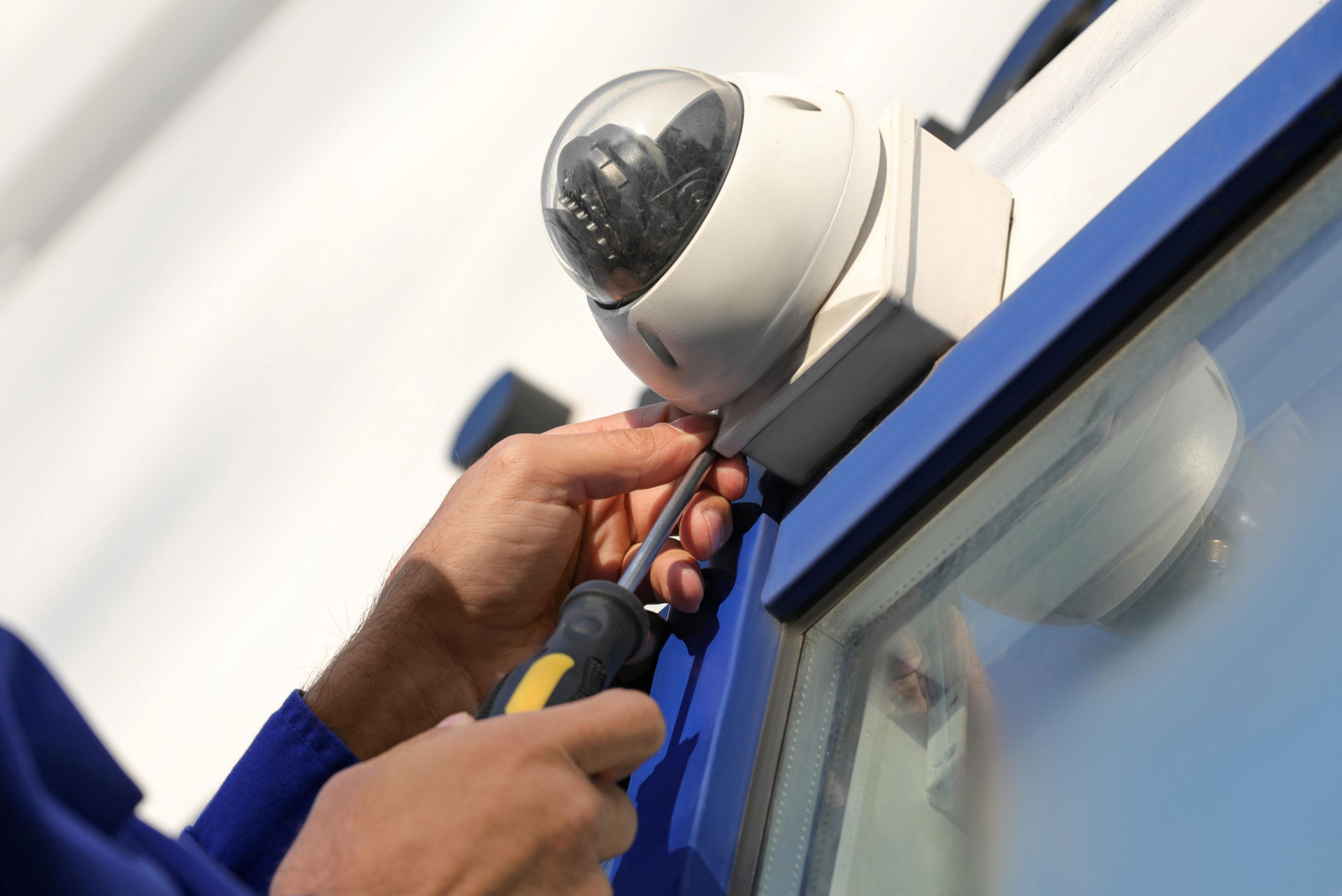 technician installing a security camera